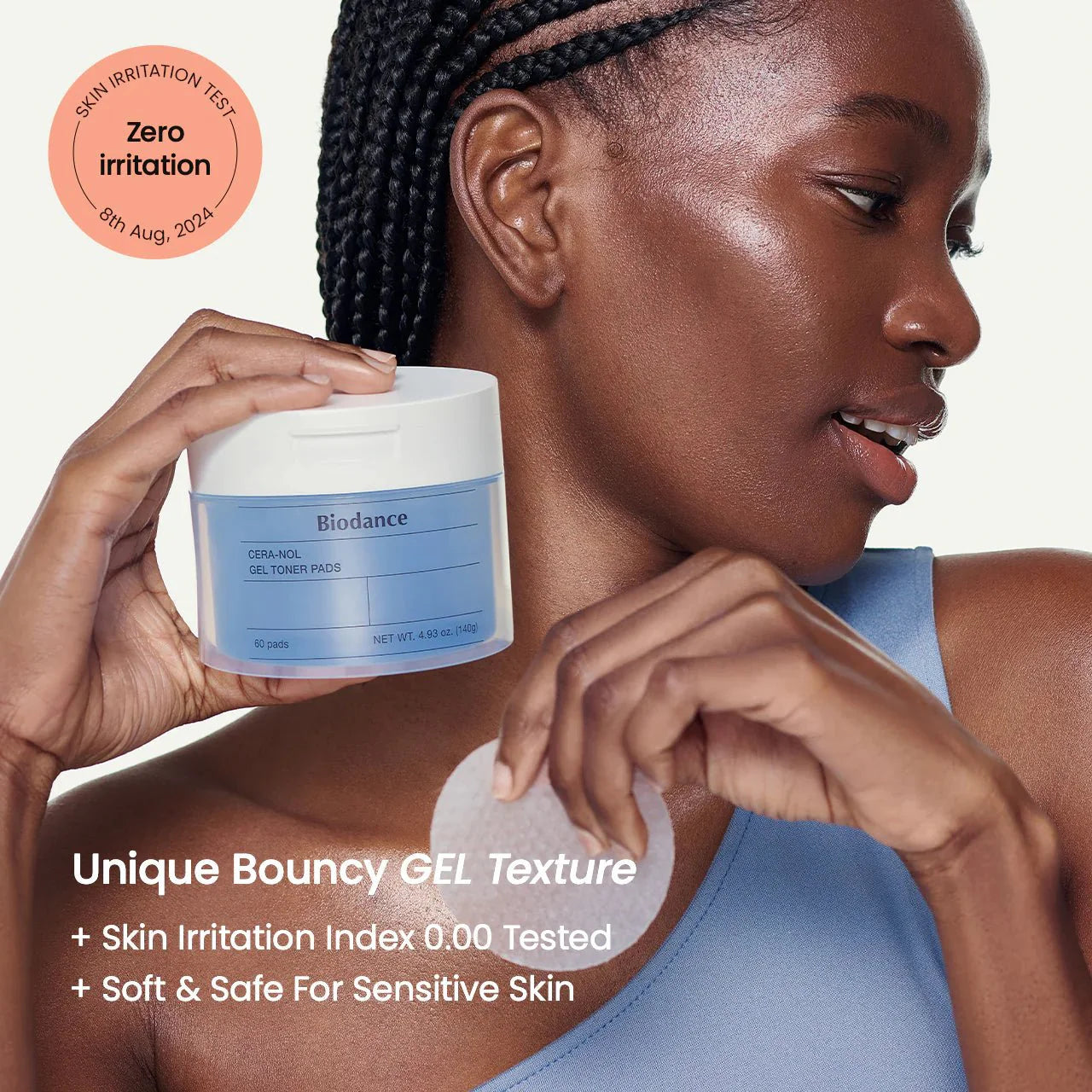 Model holding a jar of Biodance Cera-nol Gel Toner Pads featuring a soft and safe formula.