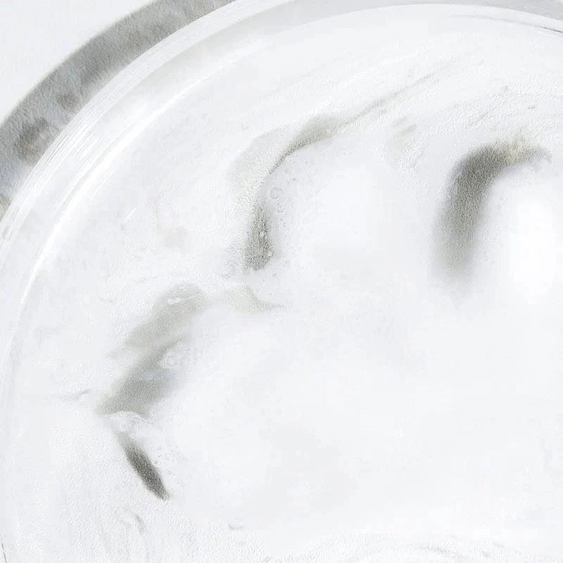 Close-up of Celimax Jojoba Cleansing Oil emulsifying into a white milky texture for deep pore cleansing.