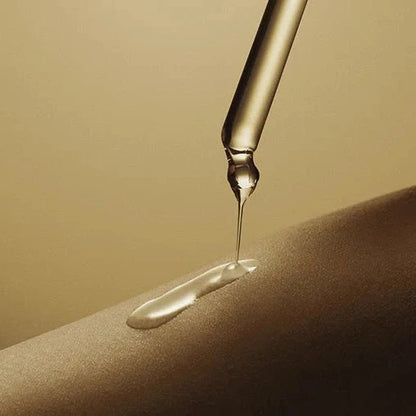 Dropper applying clear, silky Centella Teca Ampoule onto skin for soothing hydration.